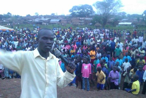 Preaching to a crowd, Uganda